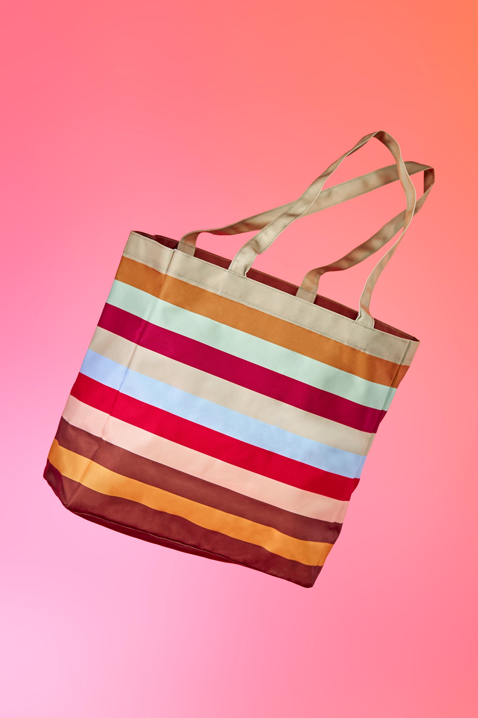 Back of tote bag featuring The Cheesecake Factory's signature stripes.